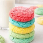 Stack of colorful sugar coated Jello cookies with red, blue, yellow and green layers