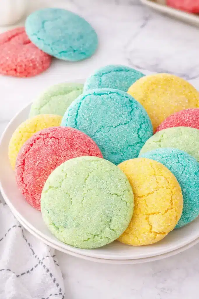 Colorful Jello cookies on a plate with sparkling sugar coating
