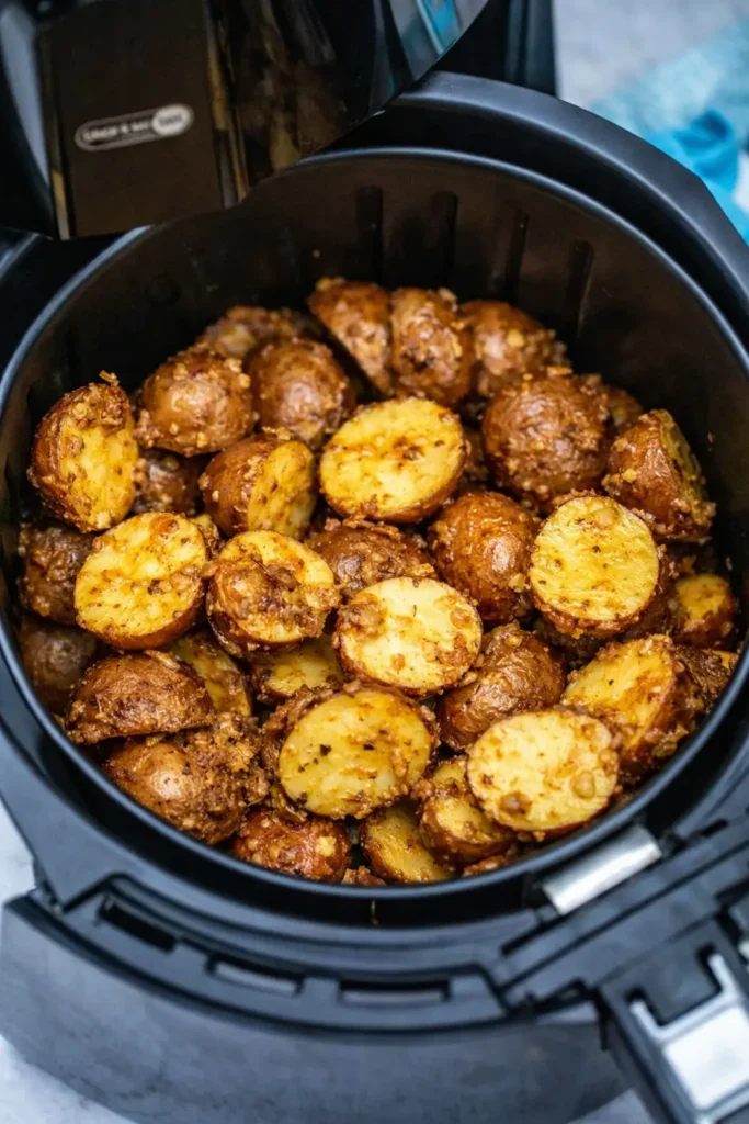 Crispy Air Fryer Potatoes Easy Amazing Side 5 Crispy Air Fryer Potatoes cooking in a black air fryer basket