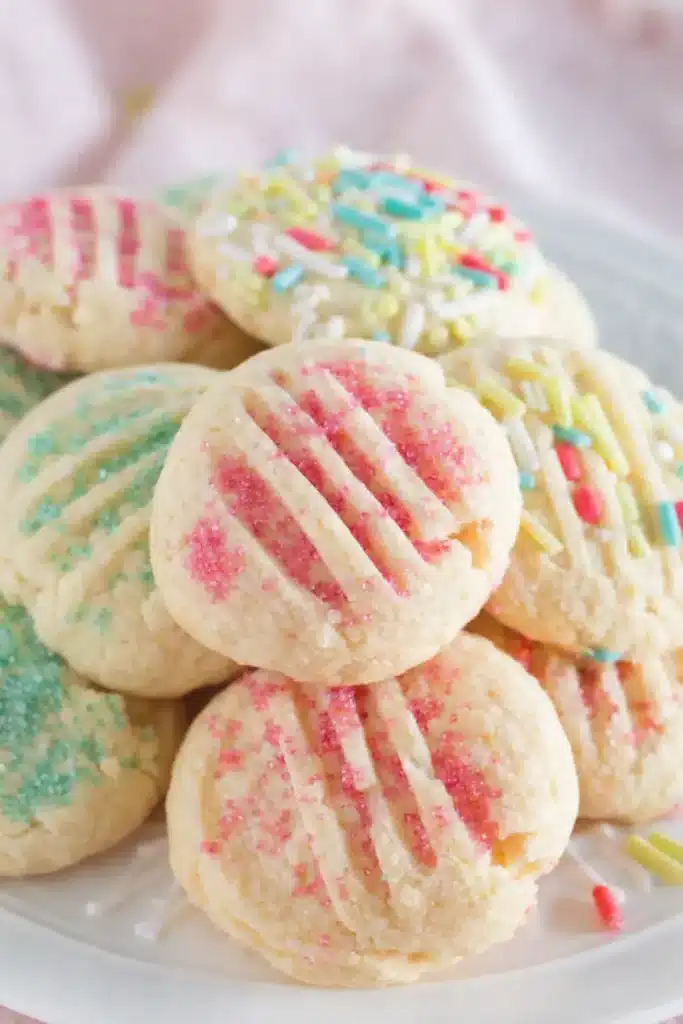 Easter Shortbread Cookies Easy Amazing Spring Recipe 6 Easter Shortbread Cookies with pastel sprinkles stacked on a plate
