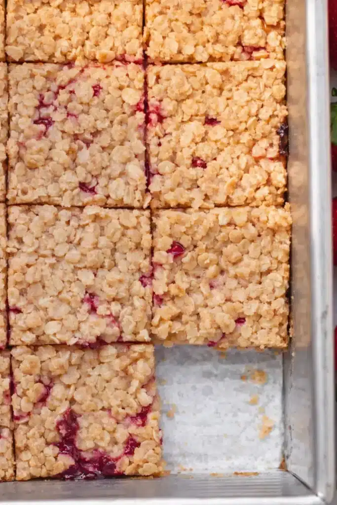 Healthy strawberry oatmeal bars baked in a pan with crumb topping