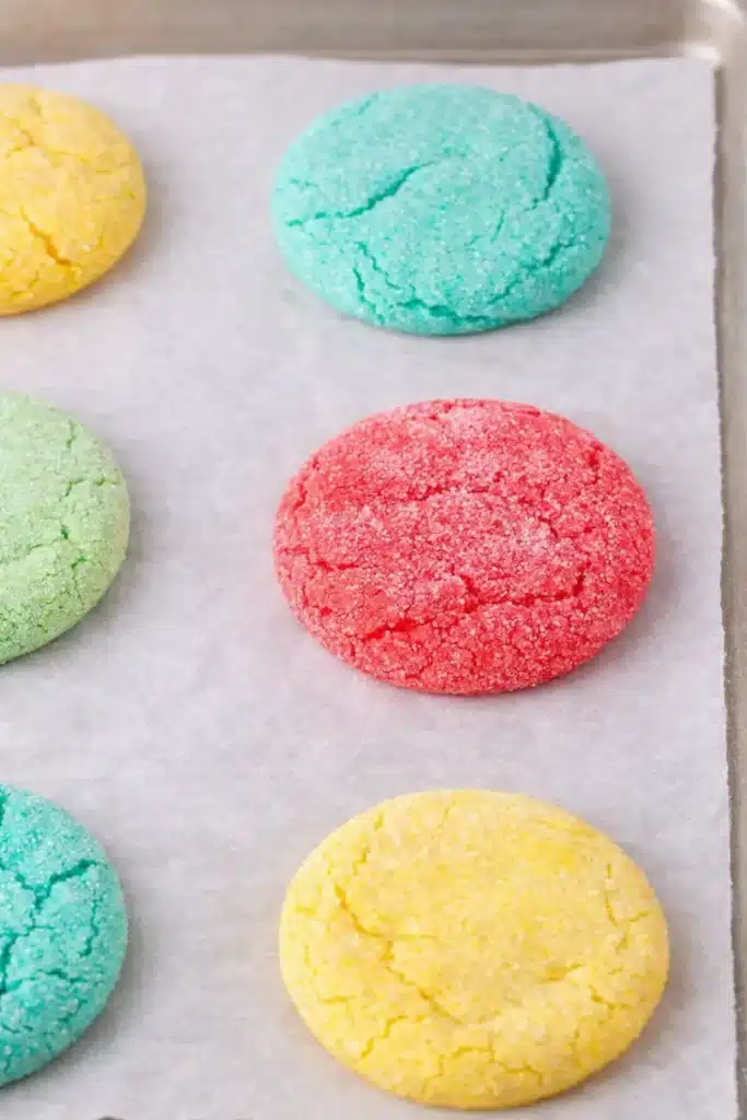 Freshly baked Jello cookies cooling on parchment lined baking tray