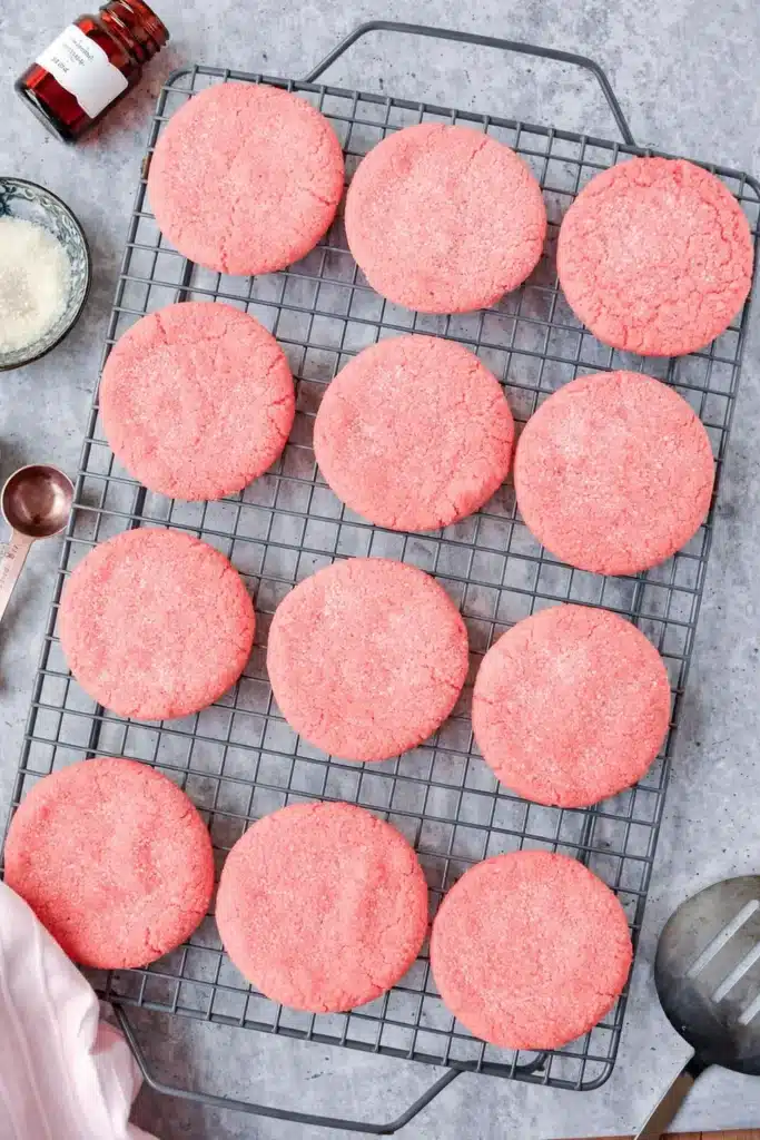 Mexican pink cookies cooling on a rack with sugar topping