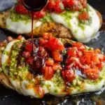 Pesto bruschetta chicken with mozzarella, basil pesto, tomatoes and balsamic glaze
