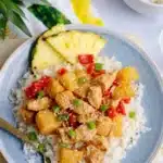 Pineapple Chicken and Rice Skillet Easy Amazing Dinner 7 Pineapple chicken and rice skillet served over white rice with pineapple, bell pepper, and green onions