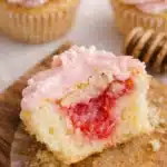 Rhubarb honey cupcake with pink frosting and sweet tart rhubarb filling
