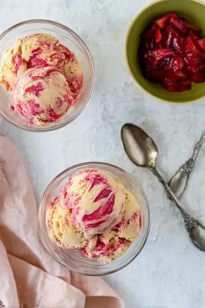 Rhubarb Ice Cream in glass bowls with rhubarb swirls and compote