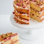 Rhubarb pistachio salted caramel layer cake with moist layers and creamy frosting