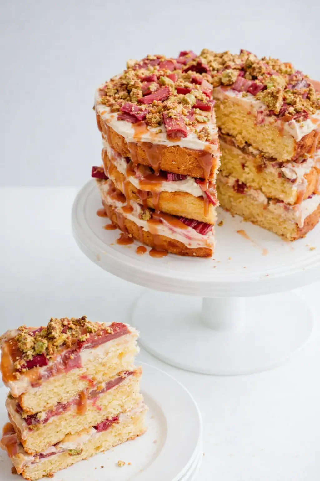 Rhubarb pistachio salted caramel layer cake with moist layers and creamy frosting