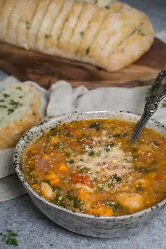 winter minestrone soup with beans vegetables and garlic bread