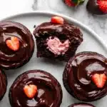 Chocolate strawberry cupcakes with ganache and creamy strawberry filling