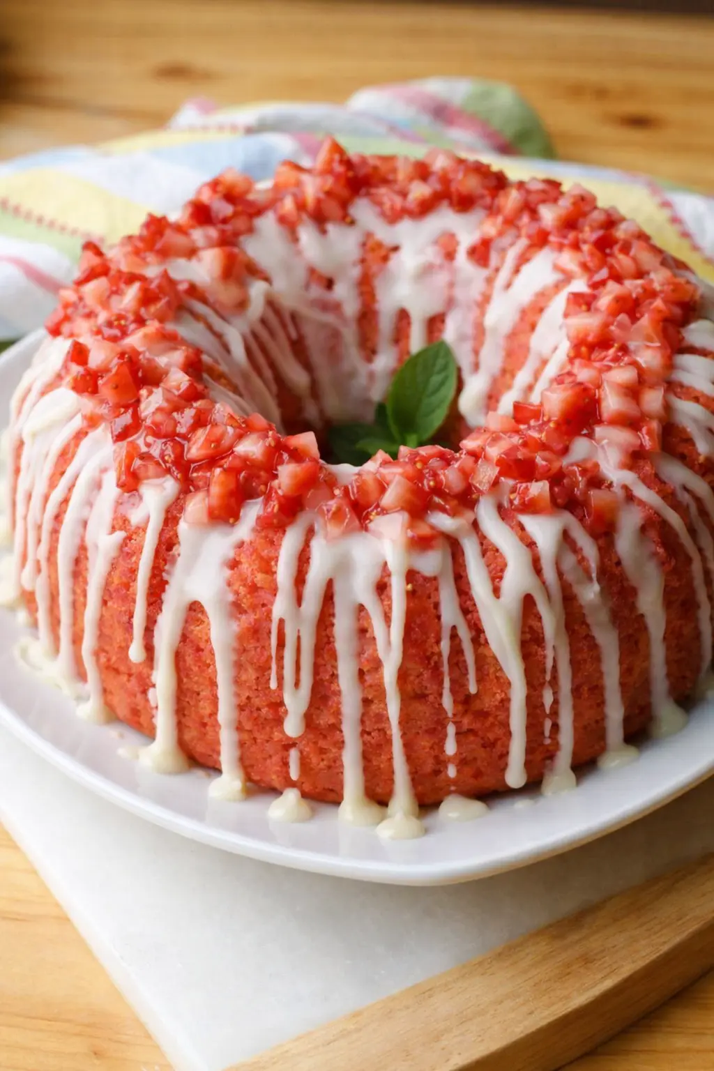 Strawberry pound cake with white glaze and fresh strawberry topping