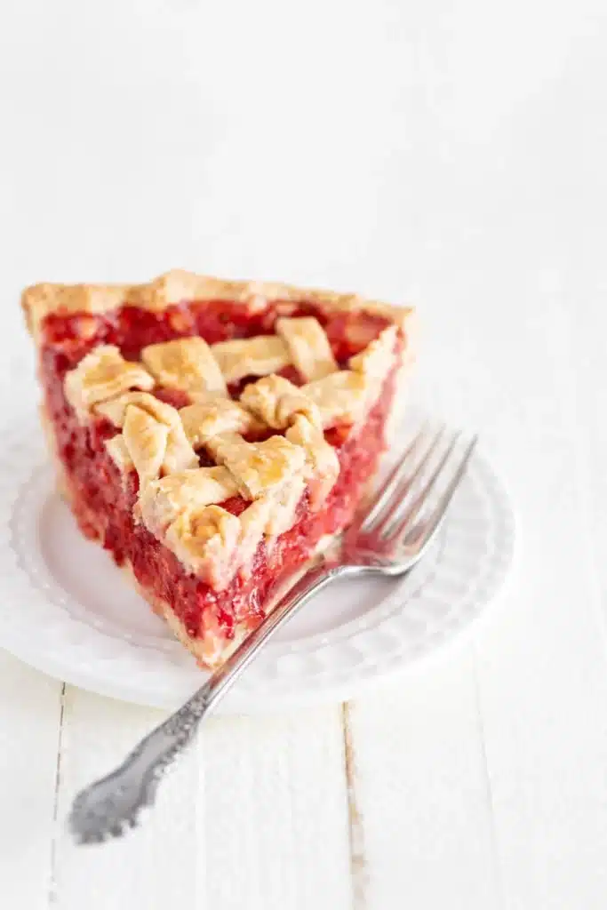 Strawberry Rhubarb Pie Recipe That Feels Amazing 7 Strawberry Rhubarb Pie Recipe slice on plate with fork