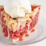 Strawberry Rhubarb Pie Recipe That Feels Amazing 9 Slice of strawberry rhubarb pie with vanilla ice cream and flaky lattice crust