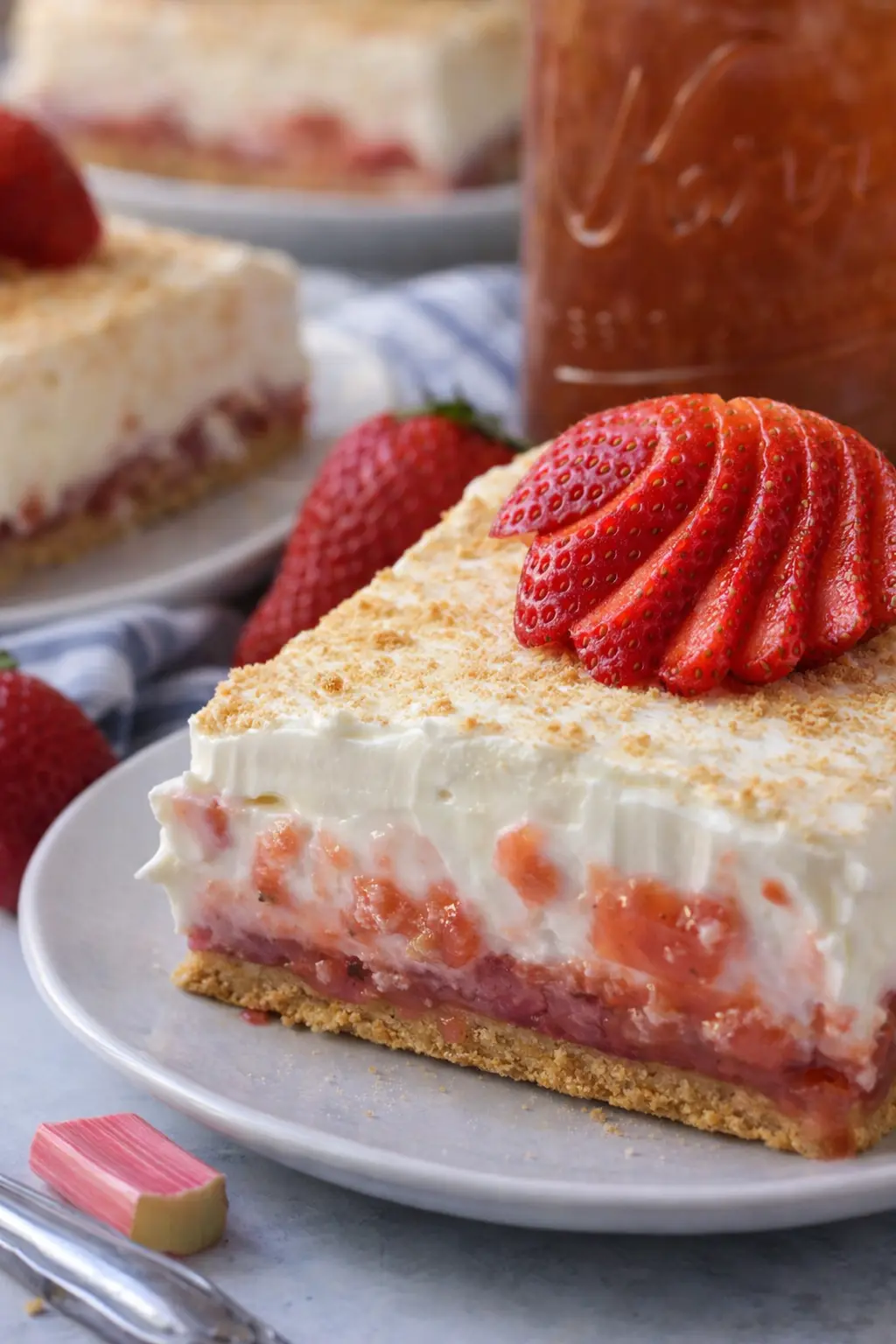 home 9 Strawberry rhubarb pudding dessert slice with creamy layers and graham crust