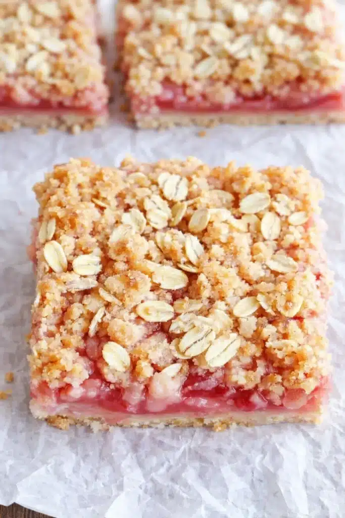 Homemade Rhubarb Crumble Bars Recipe That Feels Amazing 5 Homemade Rhubarb Crumble Bars with pink filling and oat crumble topping