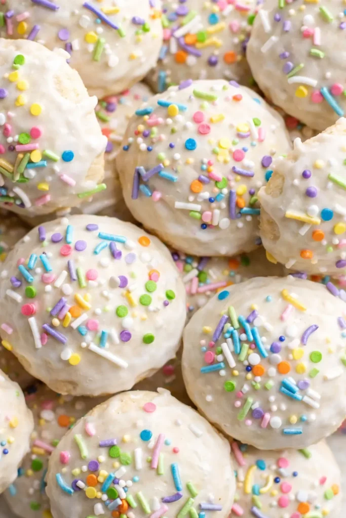 Italian Easter cookies with lemon glaze and colorful sprinkles close-up