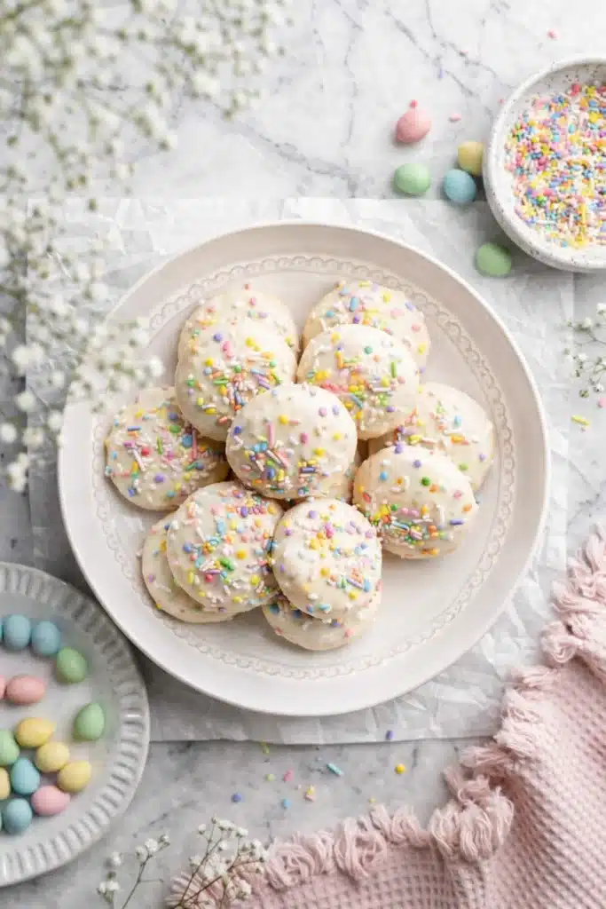 Italian Easter Cookies Recipe | Amazing Soft Lemon Treat 8 Italian Easter cookies with lemon glaze and colorful sprinkles on a serving plate