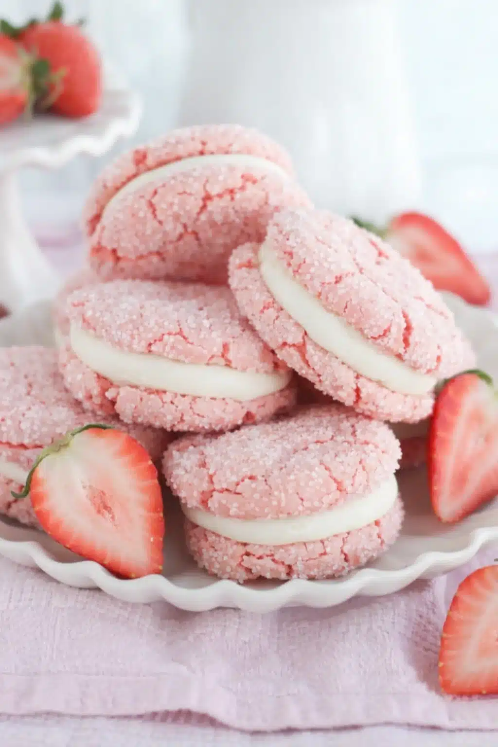 Strawberry Cake Mix Sandwich Cookies with creamy filling and fresh strawberries
