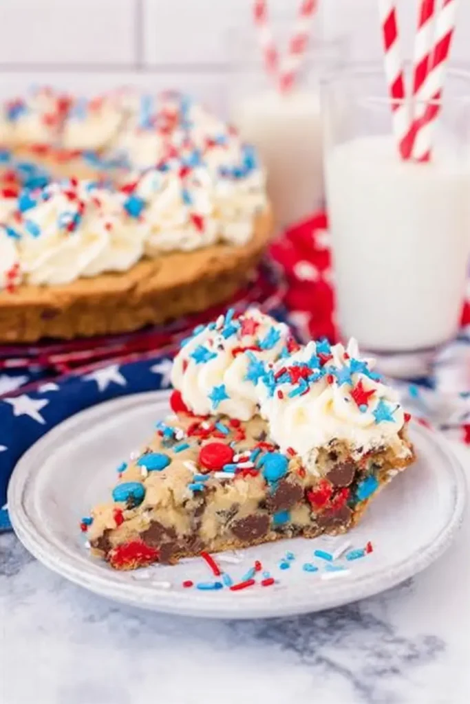 4th of July cookie cake slice with frosting and festive red white and blue sprinkles