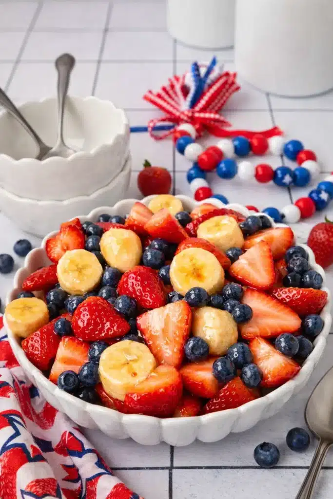 4th of July fruit salad with strawberries blueberries and bananas in serving bowl