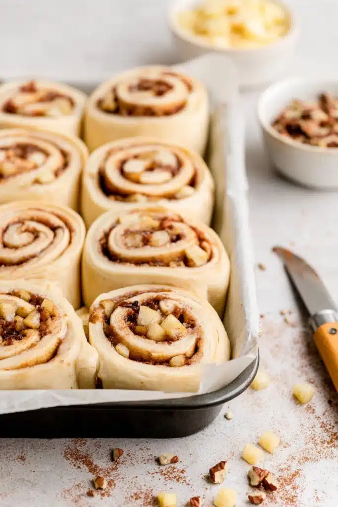 Apple Cinnamon Rolls shaped and ready to bake in pan