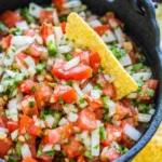 Authentic pico de gallo with fresh tomatoes, onion, cilantro, and tortilla chips