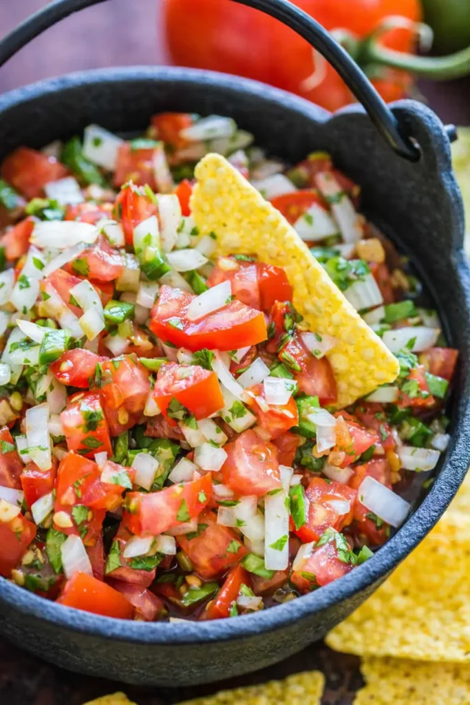Authentic pico de gallo with fresh tomatoes, onion, cilantro, and tortilla chips