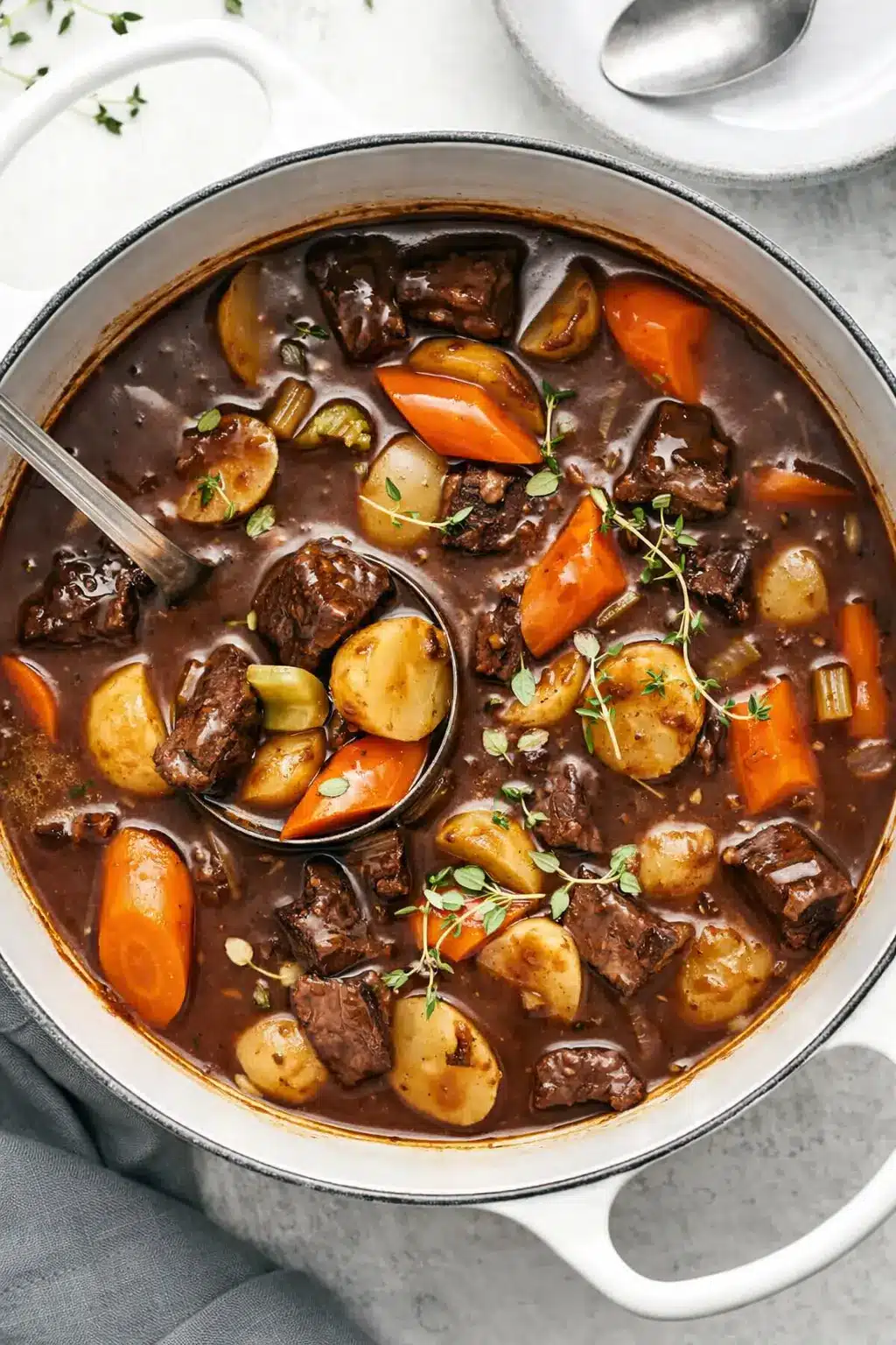 home 7 Hearty beef stew with tender beef, potatoes, and carrots in rich brown broth
