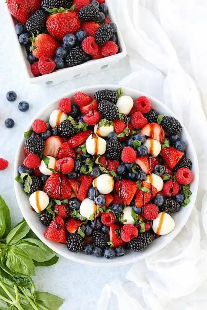Berry Caprese Salad with fresh berries mozzarella basil and balsamic glaze