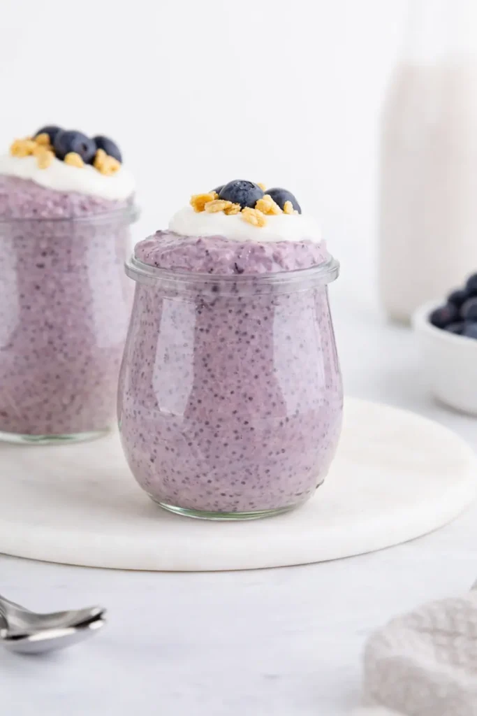 Blueberry Chia Pudding Easy Amazing Breakfast 5 Blueberry chia pudding in jar with yogurt, blueberries, and granola