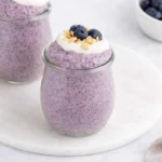 Blueberry Chia Pudding Easy Amazing Breakfast 7 Blueberry chia pudding with yogurt, fresh blueberries, and granola in a glass jar