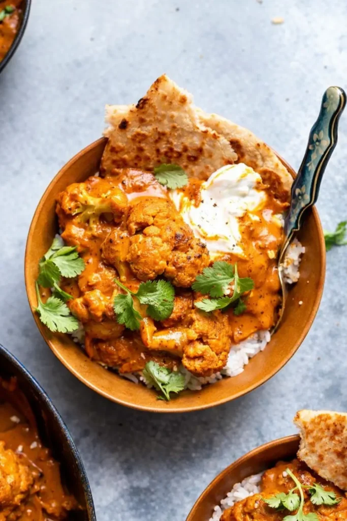 Butter Cauliflower Amazing Creamy Dinner Recipe 7 Butter cauliflower bowl with rice, naan, and yogurt