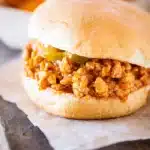 Cajun chicken sloppy joe sandwich with saucy ground chicken on toasted bun