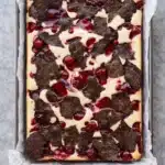 Cherry cheesecake brownies with fudgy chocolate, creamy cheesecake, and glossy cherry topping