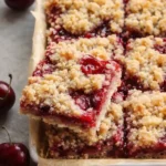 Cherry Crumble Bars Easy Amazing Homemade Treat 7 Cherry crumble bars with buttery topping and juicy cherry filling in baking dish