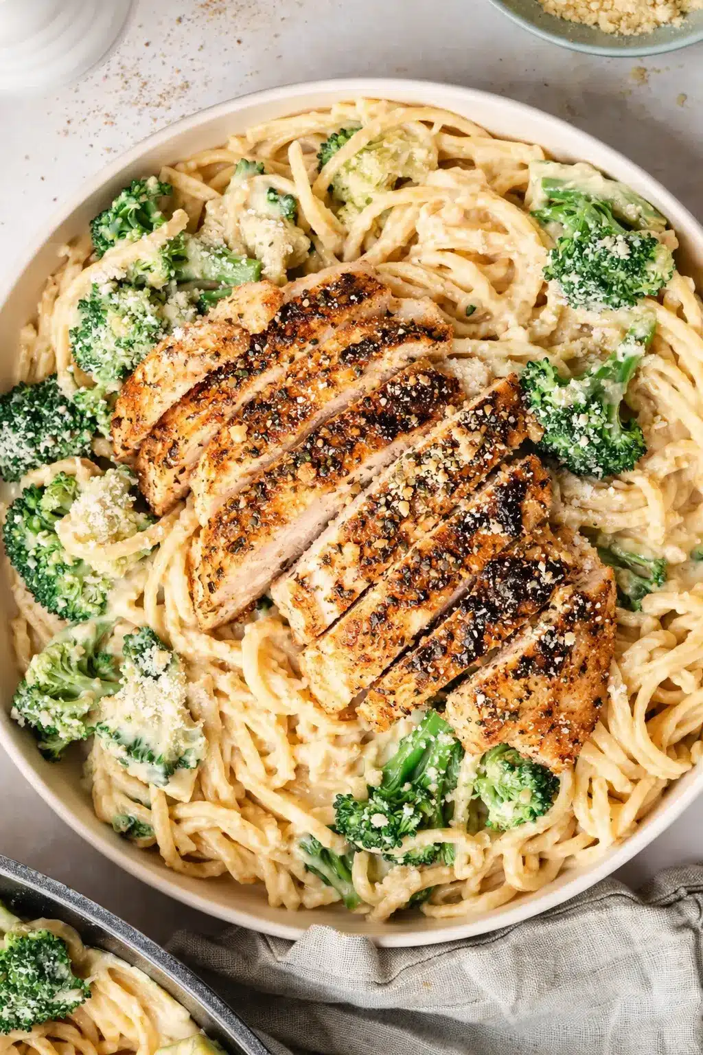 Chicken Alfredo pasta with grilled chicken and broccoli in creamy sauce