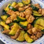 Chicken zucchini stir fry with tender chicken and fresh zucchini in glossy sauce