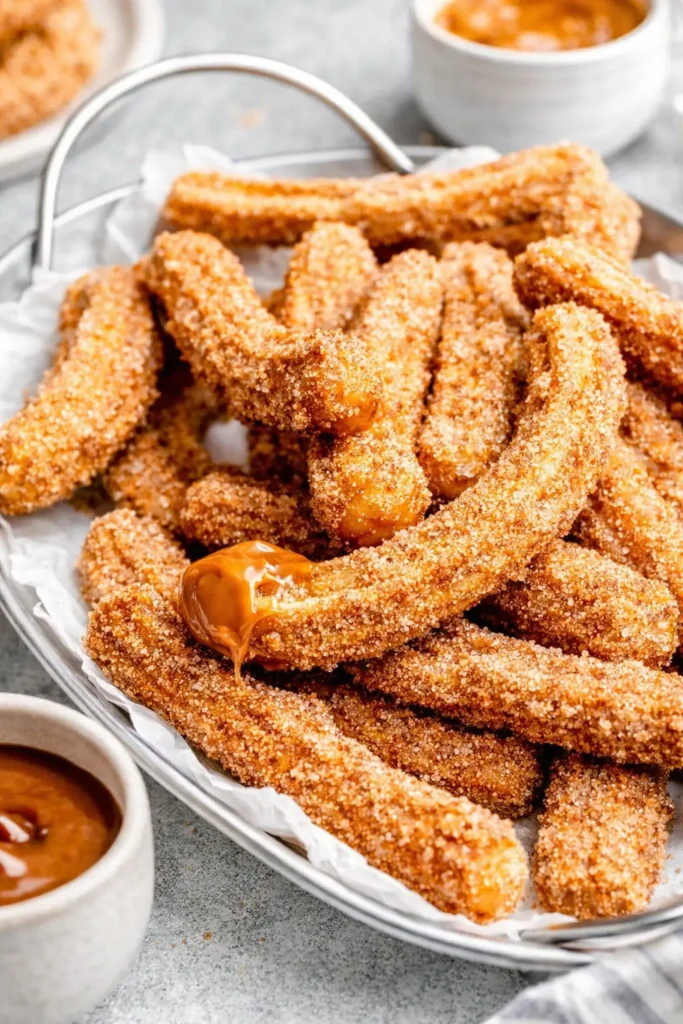 Homemade Mexican Churros Easy Irresistible Treat 6 Homemade Mexican churros dipped in caramel sauce with cinnamon sugar coating