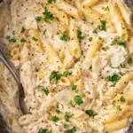 Crockpot Chicken Alfredo with penne pasta in creamy parmesan sauce