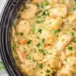 Crockpot Chicken and Dumplings Easy Comfort Meal 7 Crockpot chicken and dumplings with creamy broth, fluffy dumplings, peas and carrots