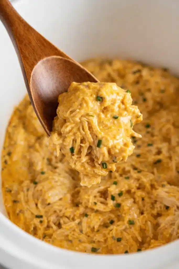 Crockpot French Market Chicken Easy Delicious Family Dinner 6 Crockpot French Market Chicken creamy shredded chicken in sauce on spoon