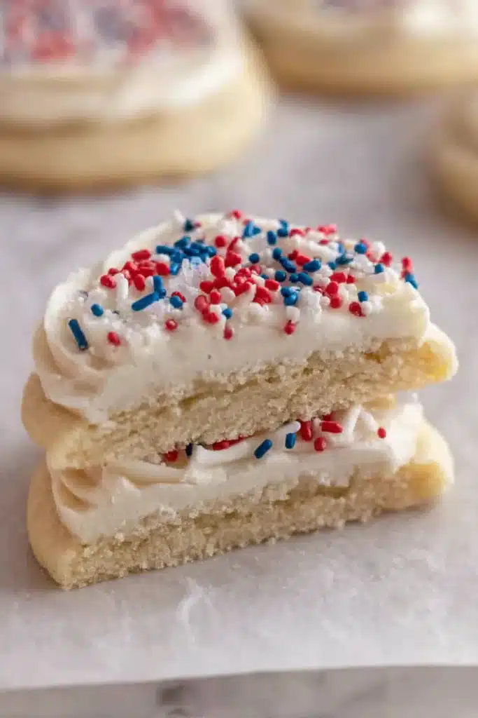 Crumbl Patriotic birthday cake cookies cut open showing soft center and frosting