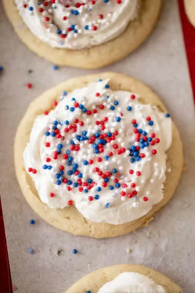 Crumbl Patriotic birthday cake cookies with frosting and red blue sprinkles
