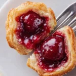 Delicious Cherry Pie Bites Easy Amazing Treat 7 Flaky cherry pie bites with glossy filling on fork close-up