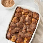 Easy Monkey Bread in baking dish with cinnamon sugar glaze and soft pull apart texture