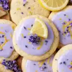Lemon Lavender Cookies Easy Amazing Treat 7 Lemon lavender cookies with purple glaze, lemon slices, and dried lavender on a light surface