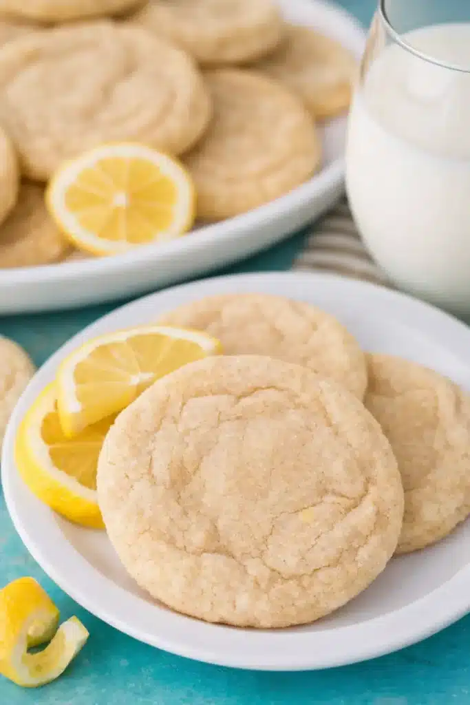 lemon sugar cookie recipe with soft cookies lemon slices and milk