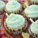 Margarita Cupcakes with Tequila Lime Amazing Party Treat 7 Margarita cupcakes with tequila lime frosting and lime wedges on serving plate