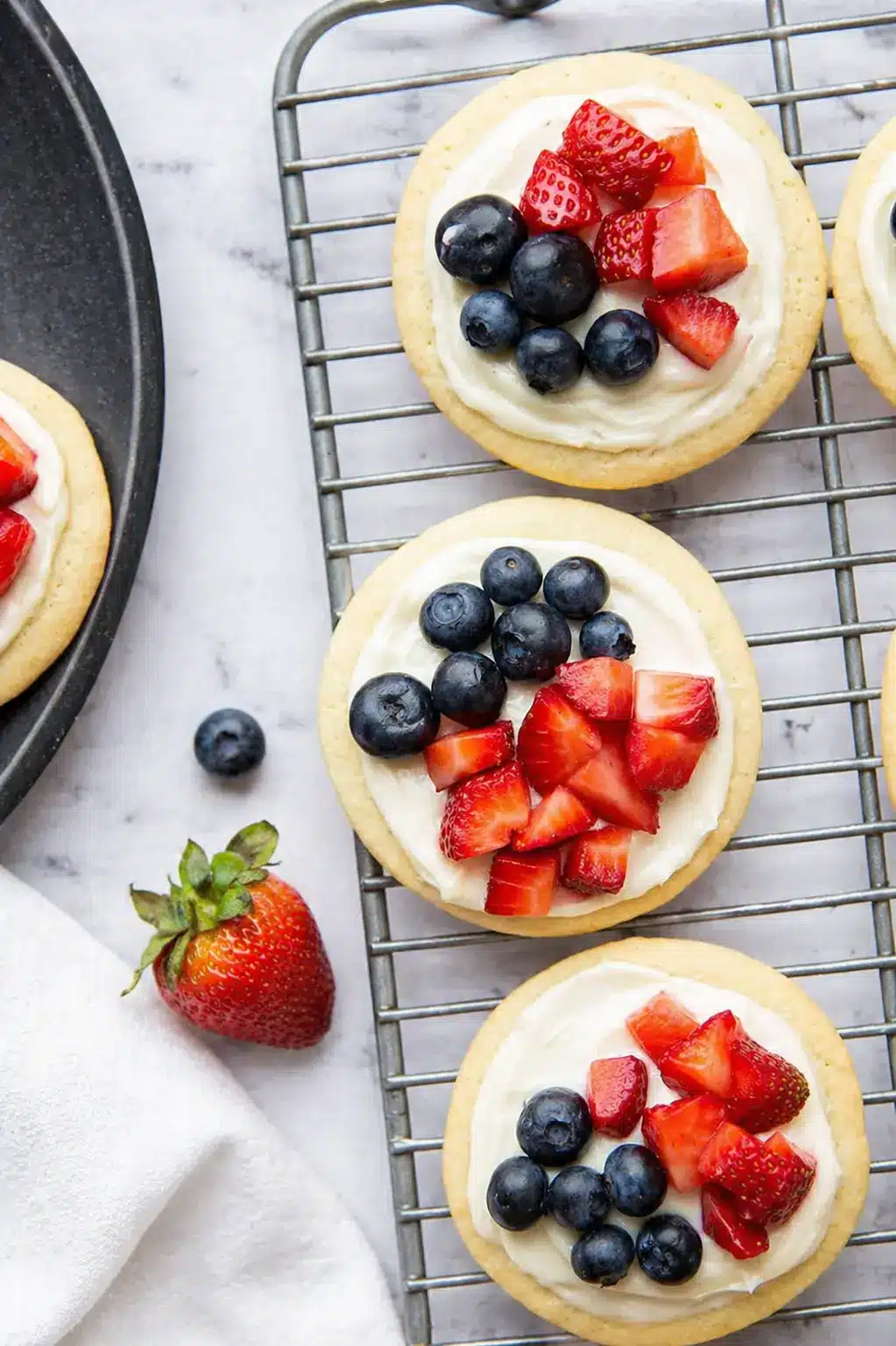 mini fruit pizzas with strawberries and blueberries on cookies ..